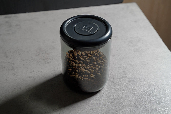 Coffee bean container push-button vacuum seal close up