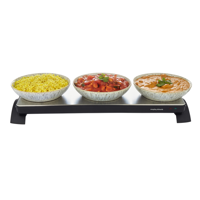 Three bowls of food on a warming tray with a white background