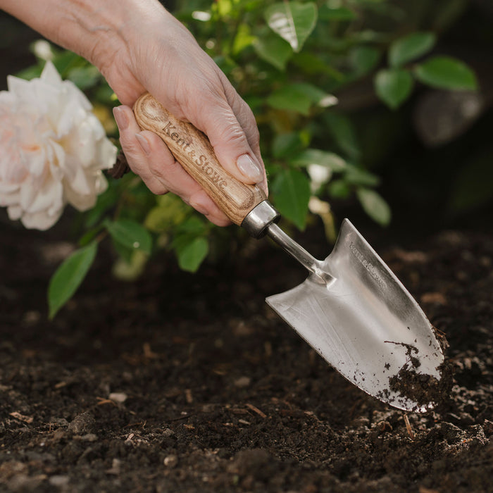 Kent & Stowe Garden Life Stainless Steel Hand Trowel in use with soil