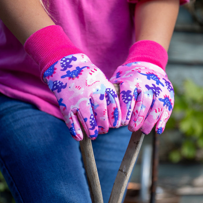Kent & Stowe Pink Dinosaur Kids Gardening Gloves on spade