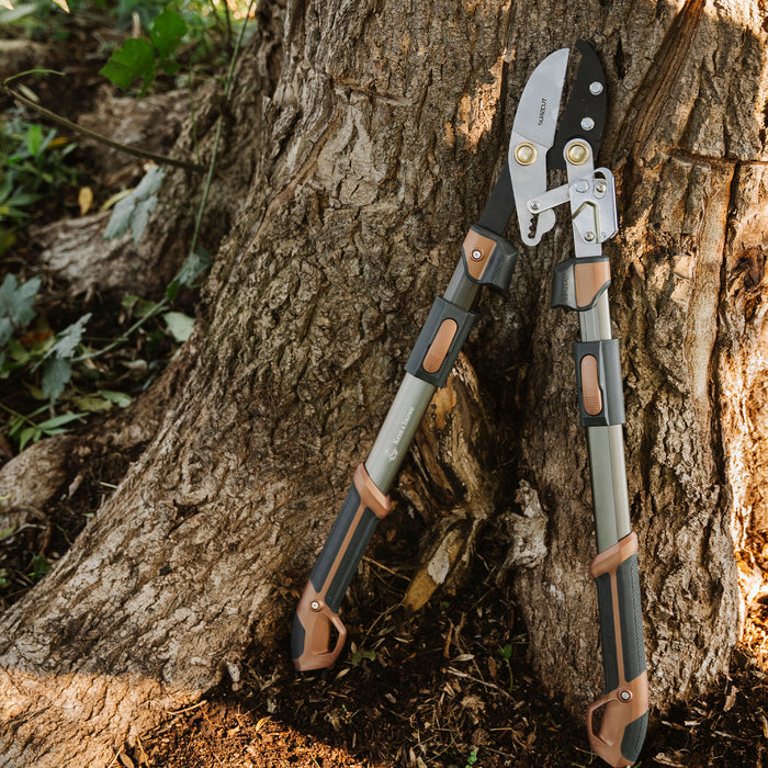Kent & Stowe SureCut Extra Power Hard Wood Ratchet Loppers leaning on tree